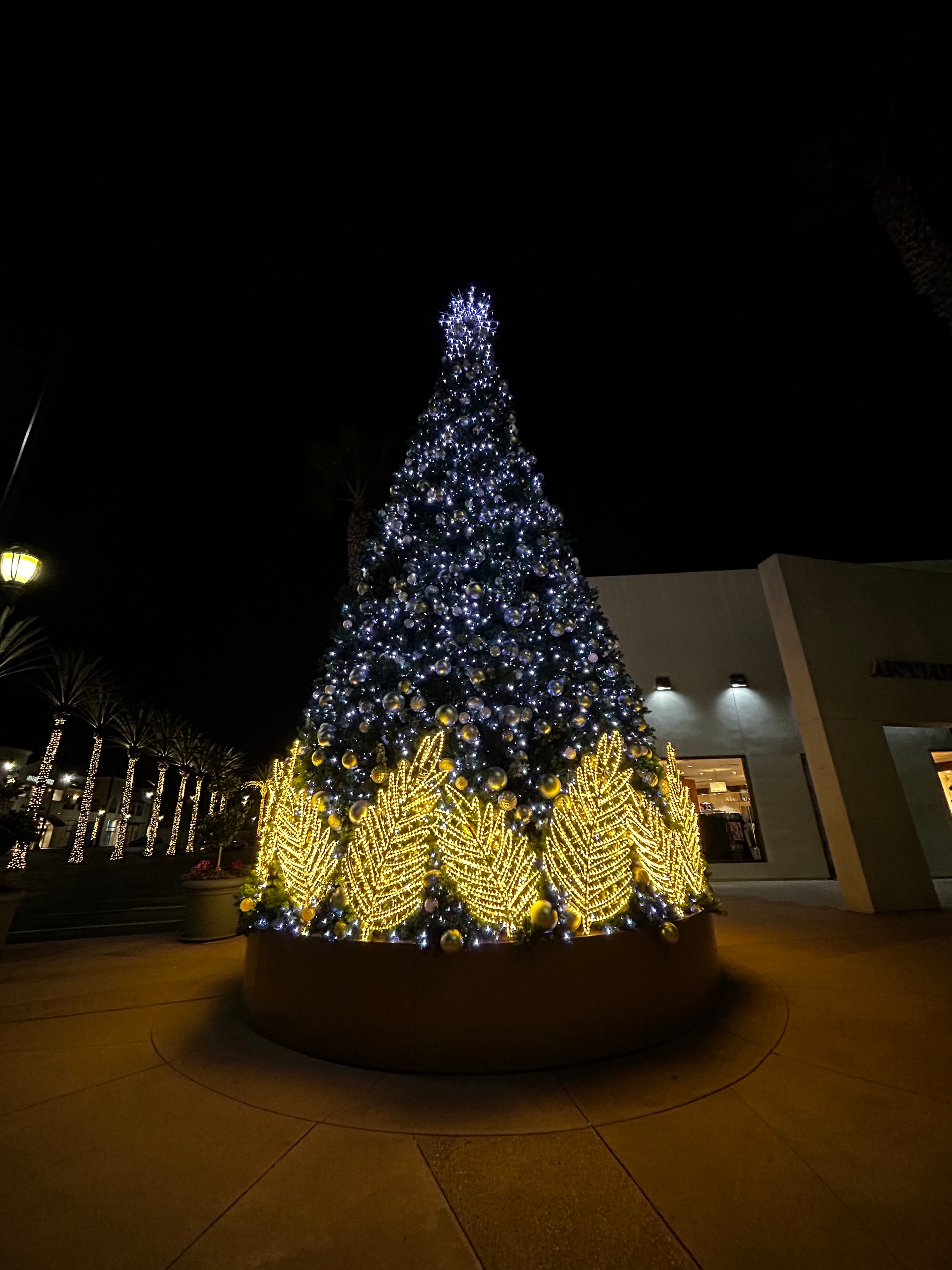 50-foot RGBW tower tree with colorful holiday lights by The Help Crew